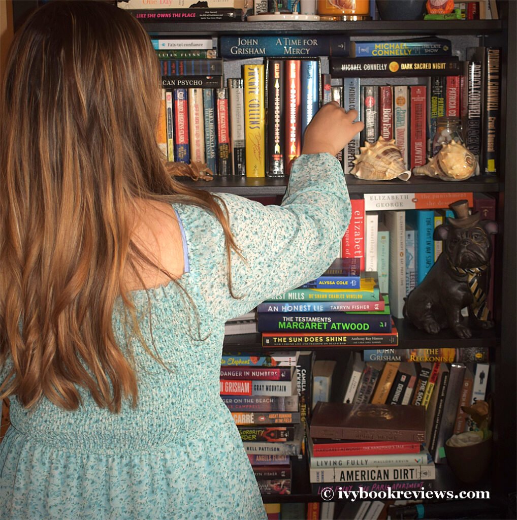 Ivy Reaching for a book in the library shelf