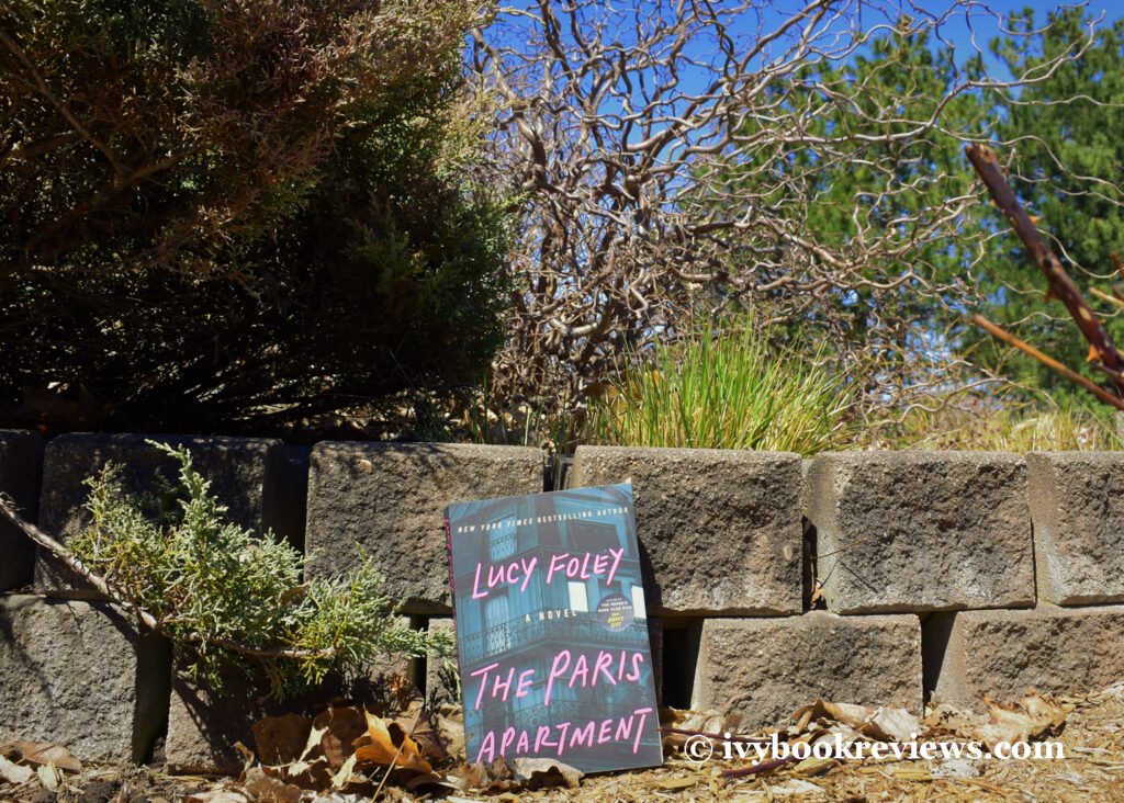 Picture of the book THE-PARIS-APARTMENT on nature's floor